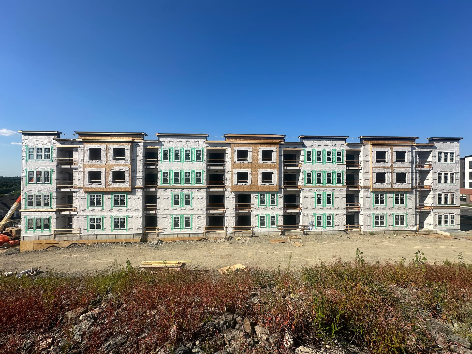 Insulation wrap on multi-family building exterior, Massachusetts