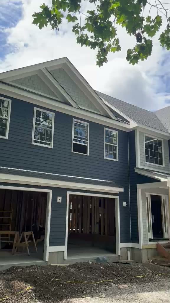 Finished navy-blue siding on colonial front with white trim, Massachusetts