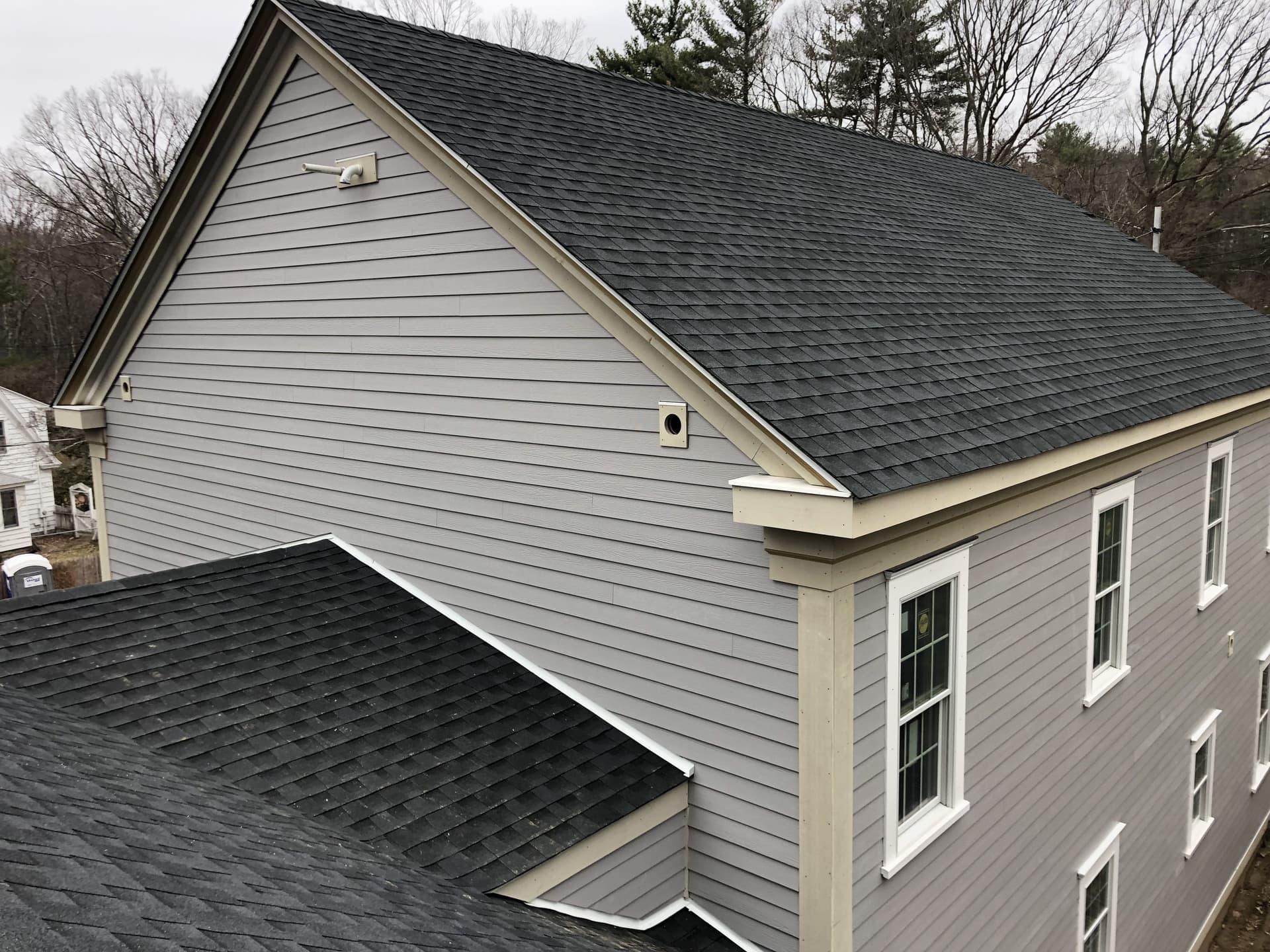 Completed roof installation aerial view by Wolf's Siding, MA