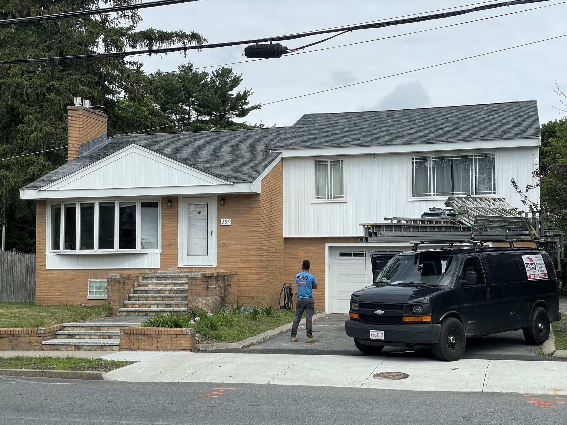 Wolf's Siding crew working on residential siding project in Massachusetts